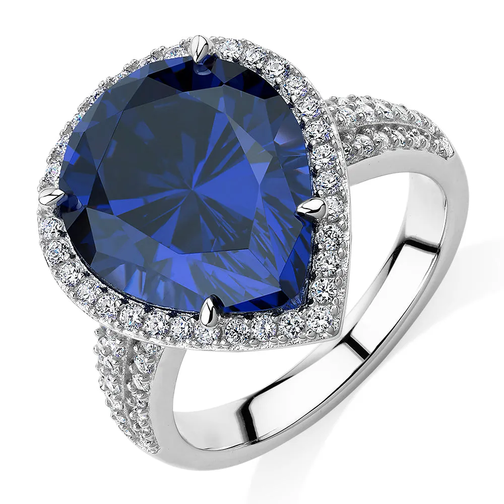 Dress ring with tanzanite simulant and 0.68 carats* of diamond simulants in sterling silver